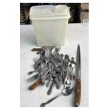 Assorted flatware and Tupperware