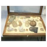 DISPLAY CASE WITH ARTIFACTS AND PRIMITIVE TOOLS