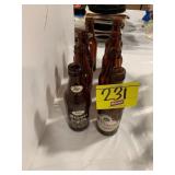 GROUP OF AMBER GLASS OLTIMER BEER BOTTLES