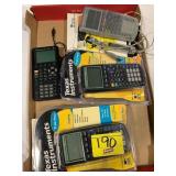 FLAT W/ TEXAS INSTRUMENTS CALCULATORS & BOOKLETS