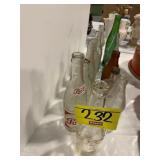2 ROWS OF ANTIQUE GLASS SODA BOTTLES