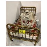 ANTIQUE BRASS DOLL BED, SKELETON FIGURE