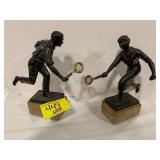 PAIR OF BRONZE TENNIS PLAYER STATUES