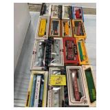GROUP OF BOXED TRAIN CARS OF ALL KINDS