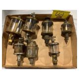 FLAT OF ANTIQUE BRASS OILERS
