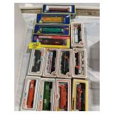 GROUP OF BOXED TRAIN CARS OF ALL KINDS
