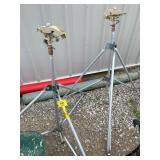 PAIR OF IMPACT SPRINKLERS ON TRIPODS