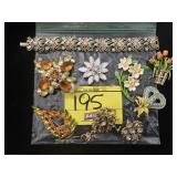 GROUP OF FANCY ORANGE/FLOWER THEMED RHINESTONE