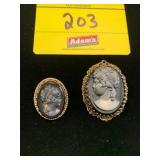 2 BLACK MONOCHROME CAMEO BROOCHES