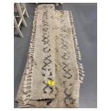LARGE TASSLE AREA RUG                   (BY LARGE