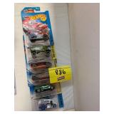 ROW OF HOT WHEELS CARS ON CARDS