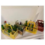 4 CARRIERS OF GLASS SODA BOTTLES OF ALL KINDS
