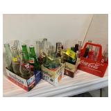 4 CARRIERS OF GLASS SODA BOTTLES OF ALL KINDS