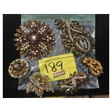 GROUP OF FANCY BROWN RHINESTONE BROOCHES