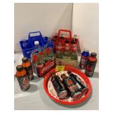 4 CARRIERS OF GLASS SODA BOTTLES OF ALL KINDS,