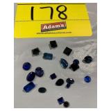 GROUP OF FACETED BLUE-TONE GEMSTONES OF ALL