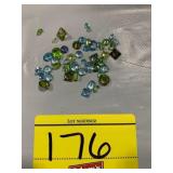 GROUP OF FACETED GREEN & BLUE TONE COLORED