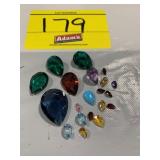 GROUP OF PEAR SHAPED FACETED GEMSTONES OF ALL