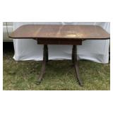 Drop leaf wooden table. Has water spots top.