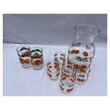Juice pitcher, five small glasses, and two larger