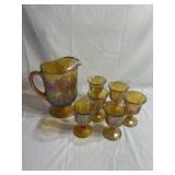Carnival glass pitcher and 6 glasses