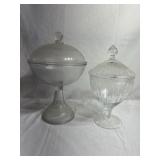 2 pedestal glass candy jars with lids. The one on