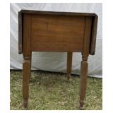 Small wooden drop leaf table with two drawers