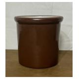 Small brown crock. Has some cracks in the glaze.