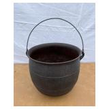Cast iron footed kettle. Marked 8 H on the bottom.