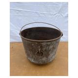 Cast iron footed kettle marked 8 E on the bottom.