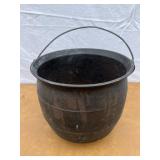 Cast iron footed kettle with 5 holes in the bottom