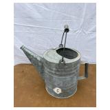 Metal watering can missing sprinkler spout