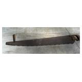 Old logging saw with helper