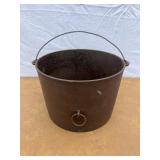 Cast iron pot with pull ring on the side. Marked 8