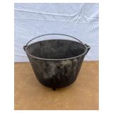 Cast iron footed kettle marked 8 on the bottom.