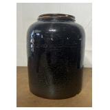 Crock canning jar with lid and fruit stamped on it