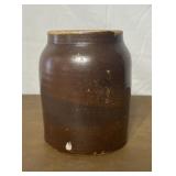 Brown crock canning jar. Has multiple chips.