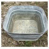 Galvanized wash tub. Marked 62.