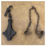 Cast iron hanging pulley and old metal cow kickers