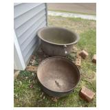 2 piece larger and smaller cast iron pots. Both ha
