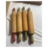 Lot of 4 wooden rolling pins. One red handle and 3