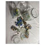 Glass jars with large and small marbles