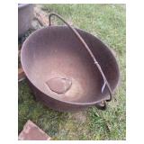 Cast Iron pot with bail. Hole in bottom.