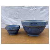 Set of 2 blue stoneware bowls. Both have some chip