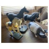 Cast iron horses, pig bank. Colorful horse is a