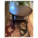 Round side table shows some wear. 23 inches in