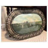 Old wall art in curved glass frame