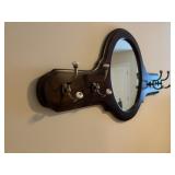 Coat hanger with mirror. 42 inches long, mirror