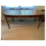 Oval dining table with two leaves