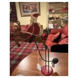 Perpetual motion Metal Santa and reindeer.